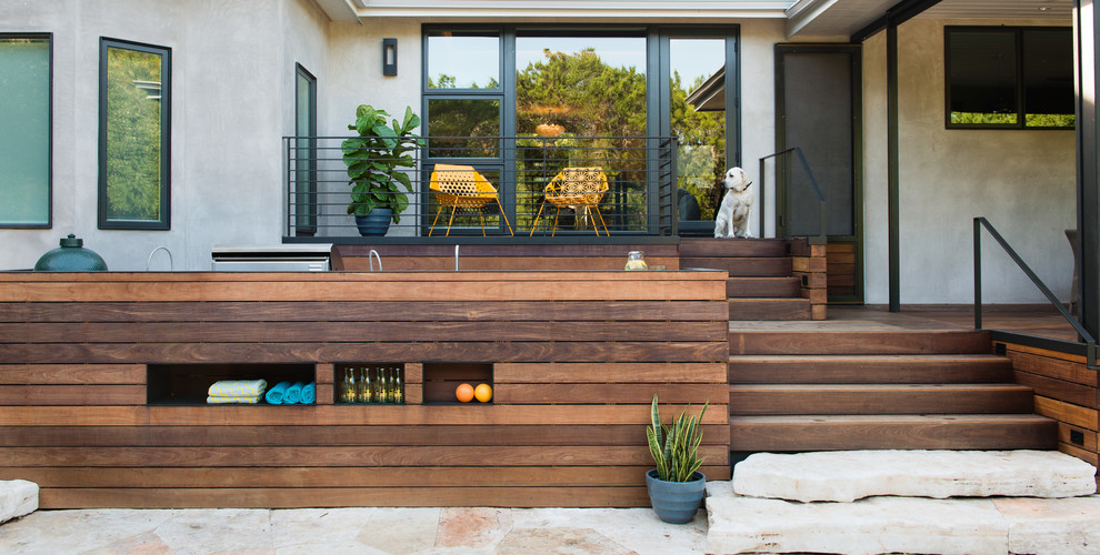 Photo of a large modern back terrace in Austin with no cover.