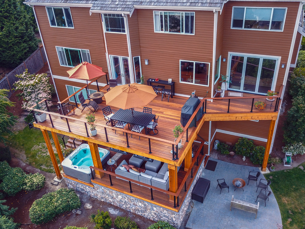 Large modern back terrace in Seattle with no cover.
