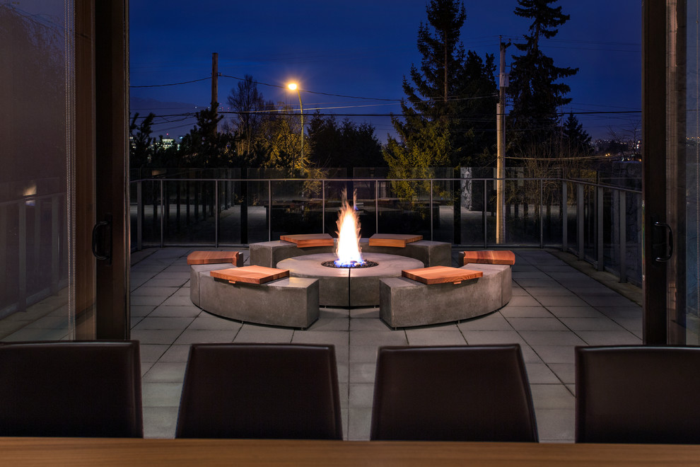 Deck - large contemporary backyard deck idea in Vancouver with a fire pit and no cover