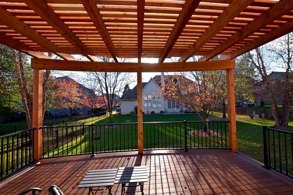 Deck - mid-sized transitional backyard deck idea in Kansas City with a pergola