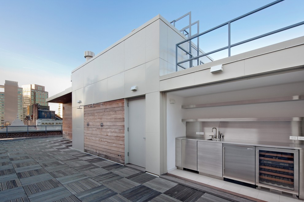Idée de décoration pour une terrasse design avec une cuisine d'été et aucune couverture.