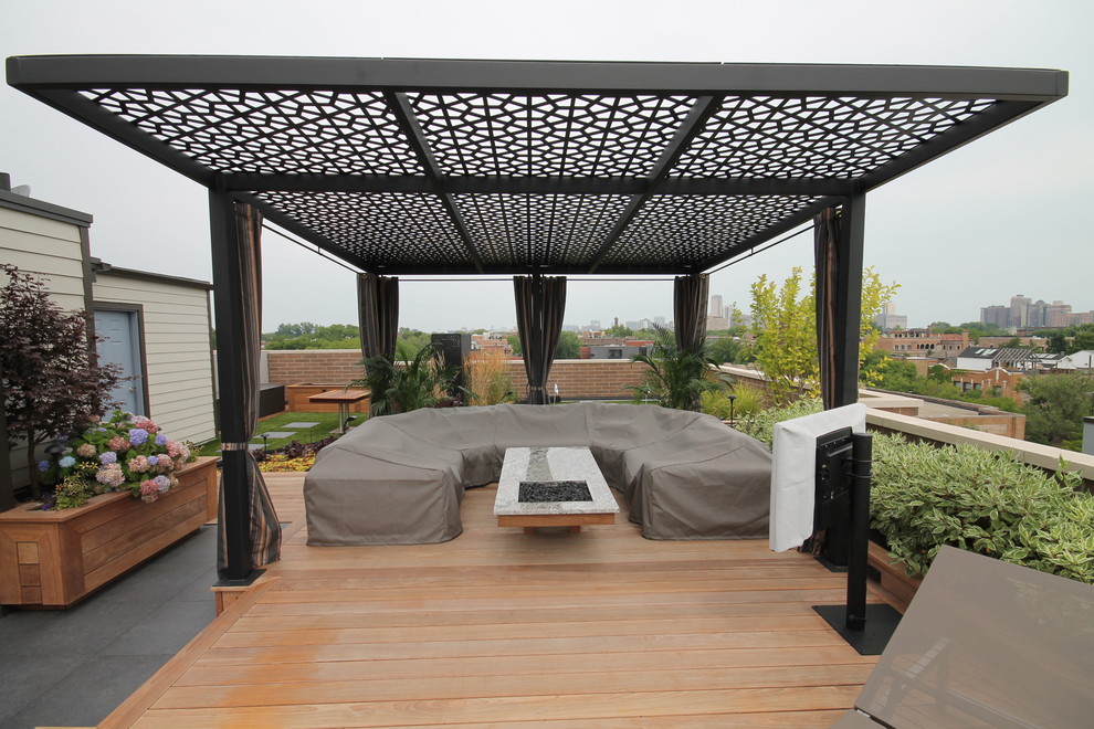 Photo of a large contemporary roof terrace in Chicago with a pergola.