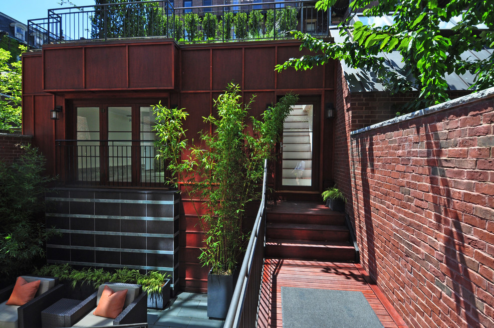 Diseño de terraza actual de tamaño medio sin cubierta en azotea con jardín de macetas