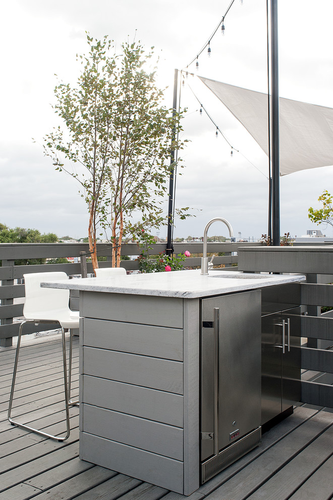 Medium sized modern roof terrace in Philadelphia with an outdoor kitchen and an awning.