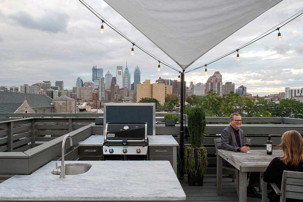 Inspiration for a mid-sized contemporary rooftop outdoor kitchen deck remodel in Philadelphia with an awning