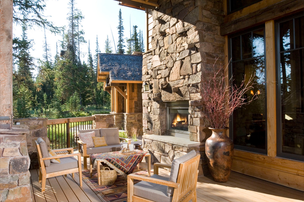 This is an example of a large rustic back terrace in Other.