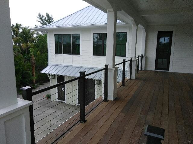 Inspiration for a large coastal rooftop deck remodel in Tampa with no cover