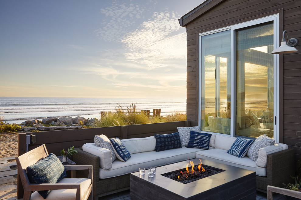 Coastal side terrace in San Francisco with a fire feature and no cover.