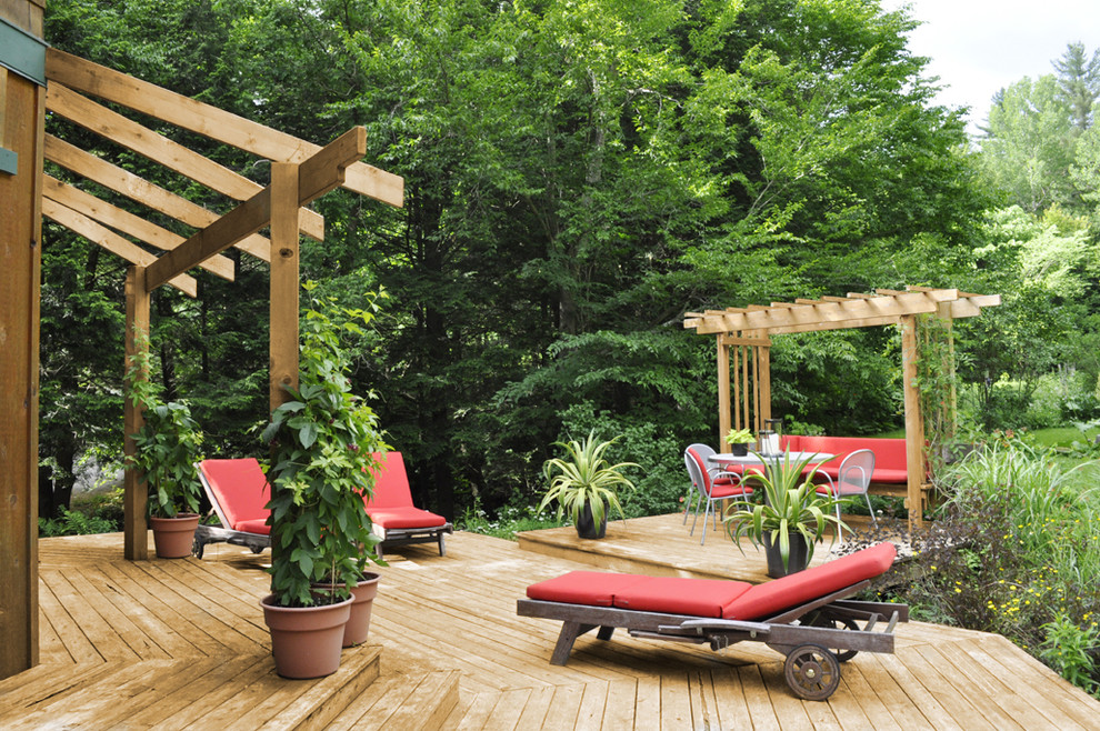 Inspiration for a medium sized classic back terrace in Burlington with a pergola.