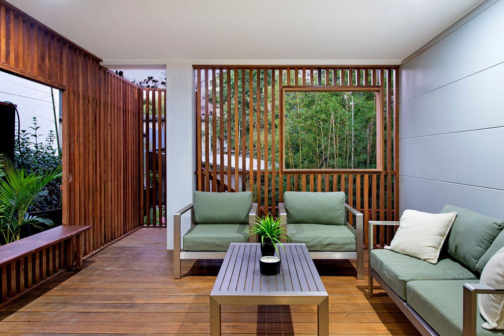 Photo of a contemporary terrace in Brisbane with a roof extension.