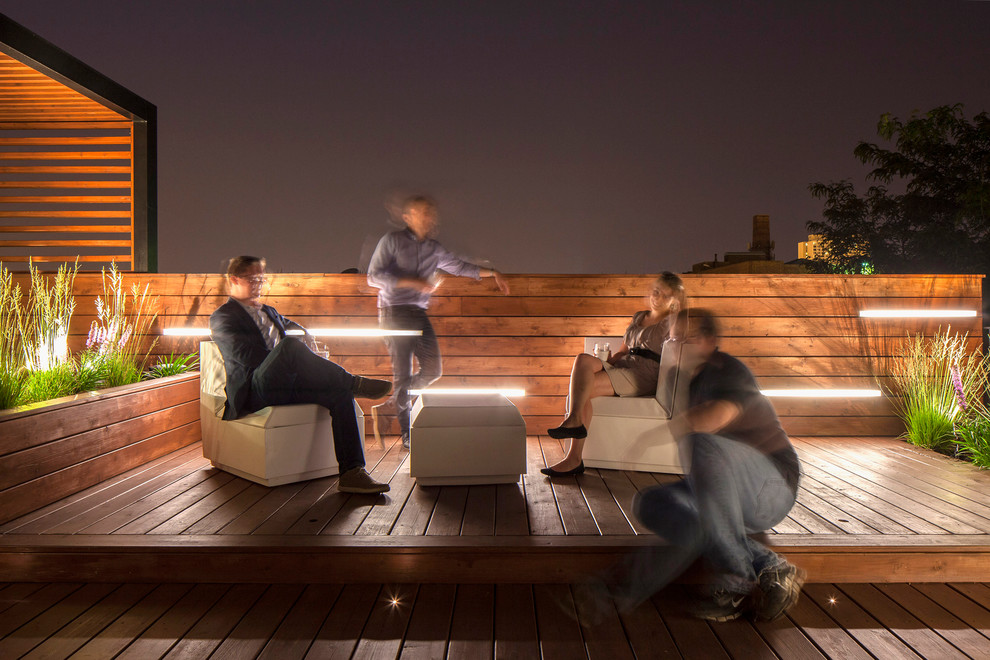 This is an example of a contemporary roof terrace in Chicago with a pergola.