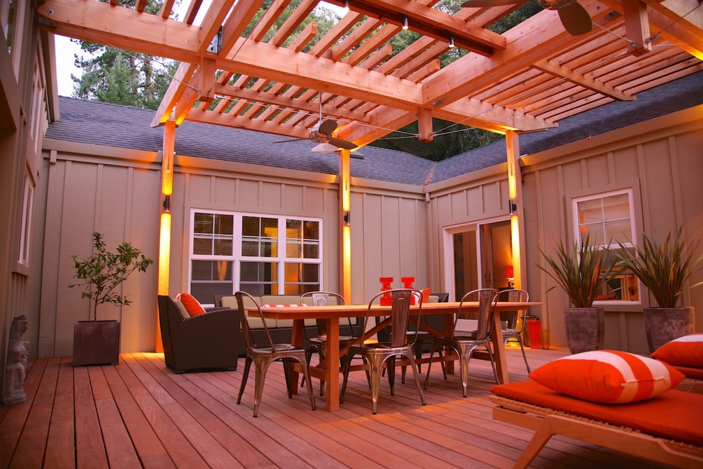 Large urban back terrace in San Francisco with a pergola.