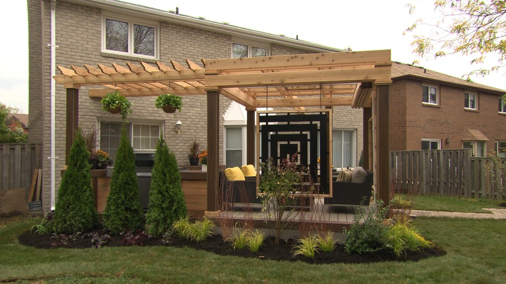 Inspiration for a mid-sized contemporary backyard outdoor kitchen deck remodel in Toronto with a pergola