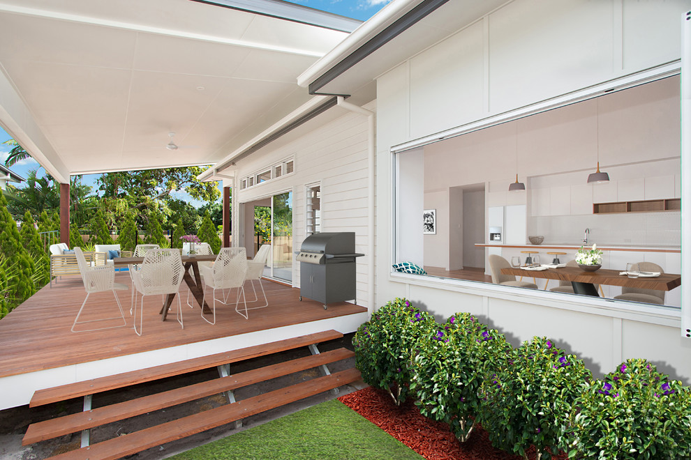 Deck - mid-sized coastal side yard deck idea in Gold Coast - Tweed with a roof extension