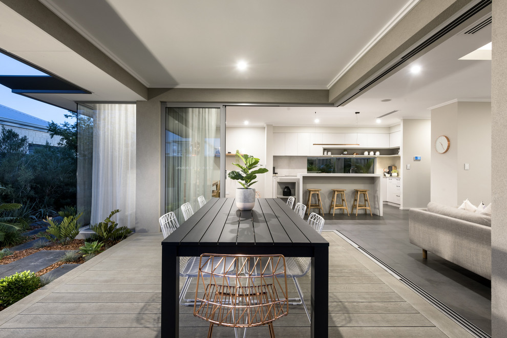 Inspiration for a contemporary backyard deck remodel in Perth with a roof extension