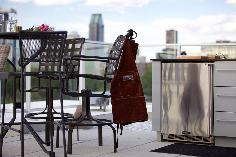Medium sized contemporary roof terrace in Montreal with an outdoor kitchen and no cover.