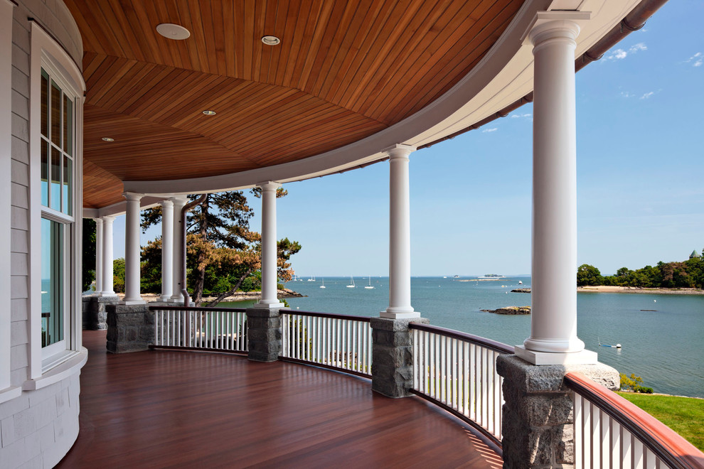 Elegant deck photo in New York with a roof extension