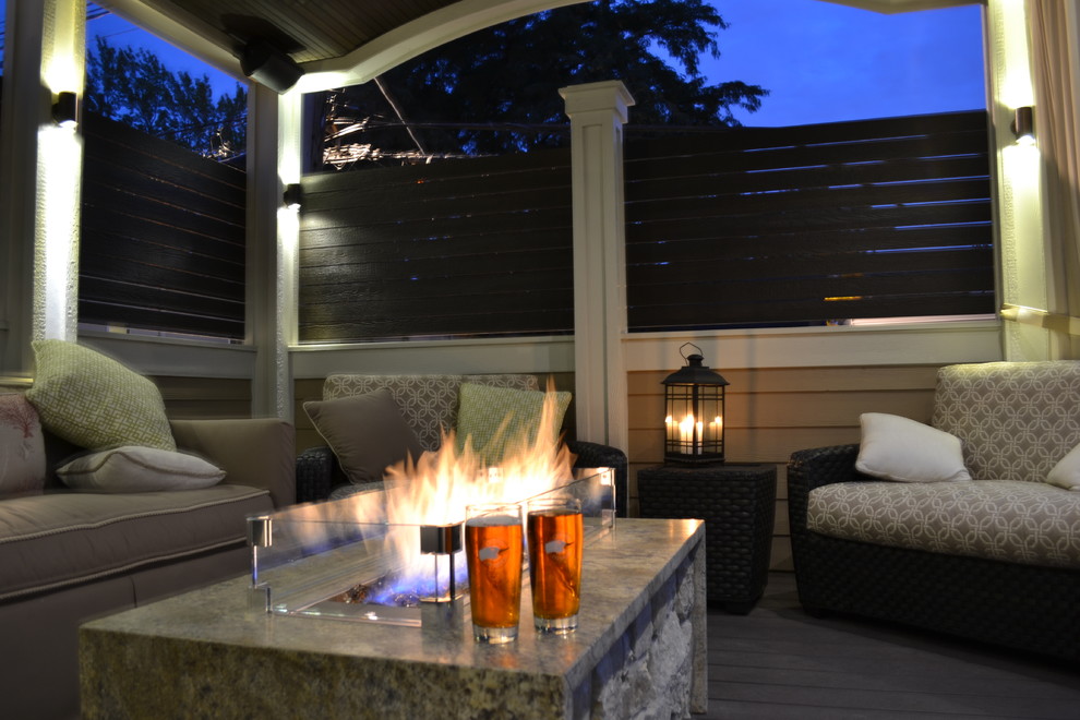 Deck - mid-sized traditional rooftop deck idea in Chicago with a fire pit and a roof extension