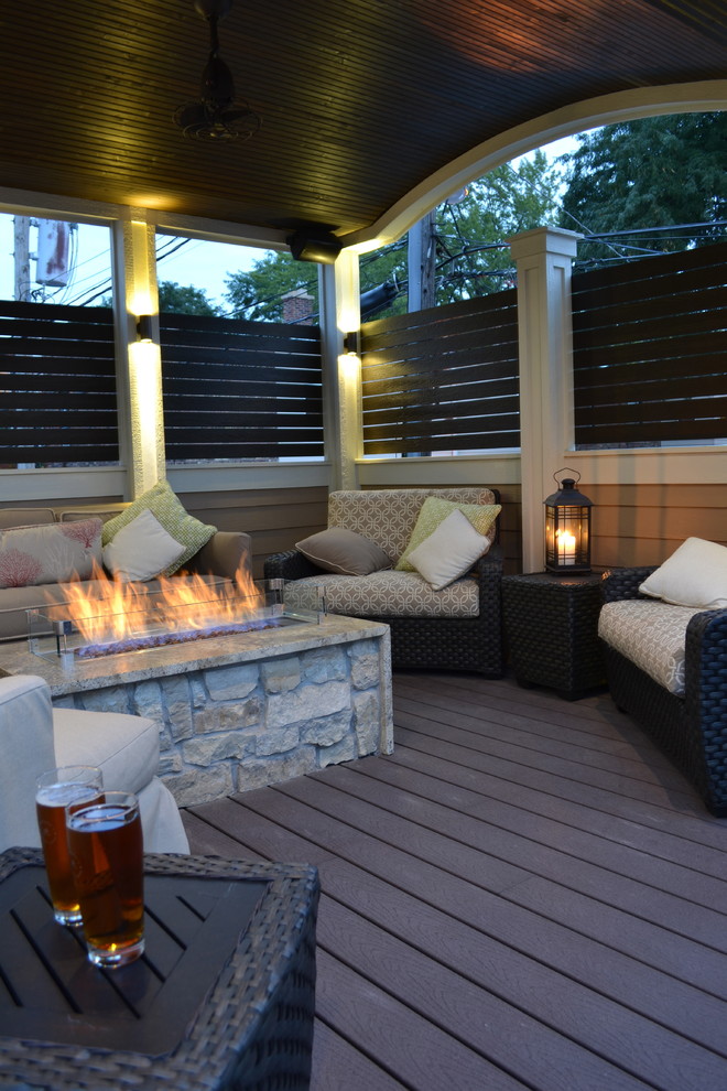Inspiration for a medium sized traditional roof terrace in Chicago with a fire feature and a roof extension.