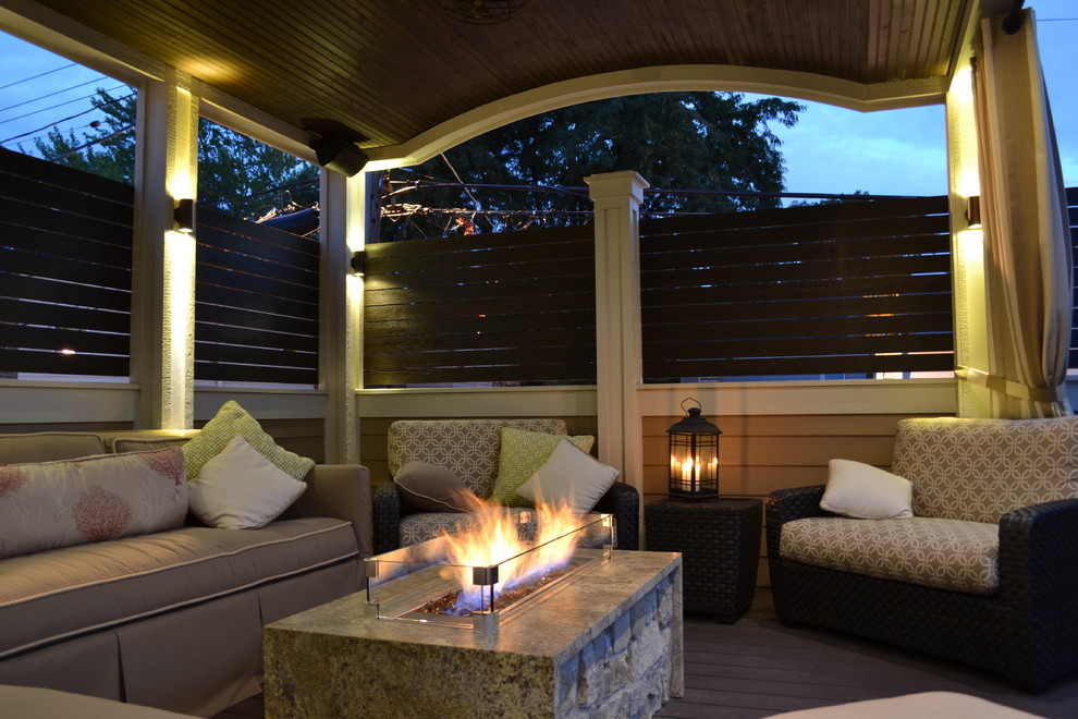 Mid-sized elegant rooftop deck photo in Chicago with a fire pit and a roof extension