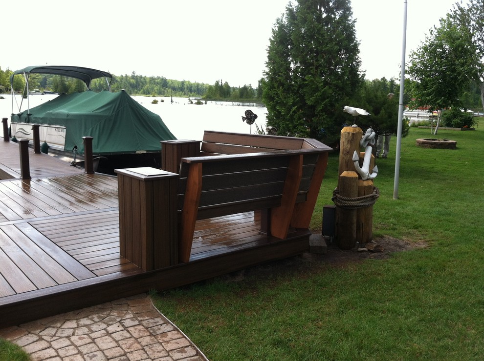Photo of a medium sized nautical back terrace in Other with a dock and no cover.