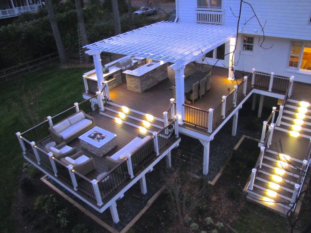 Inspiration for a large timeless backyard outdoor kitchen deck remodel in DC Metro with a pergola