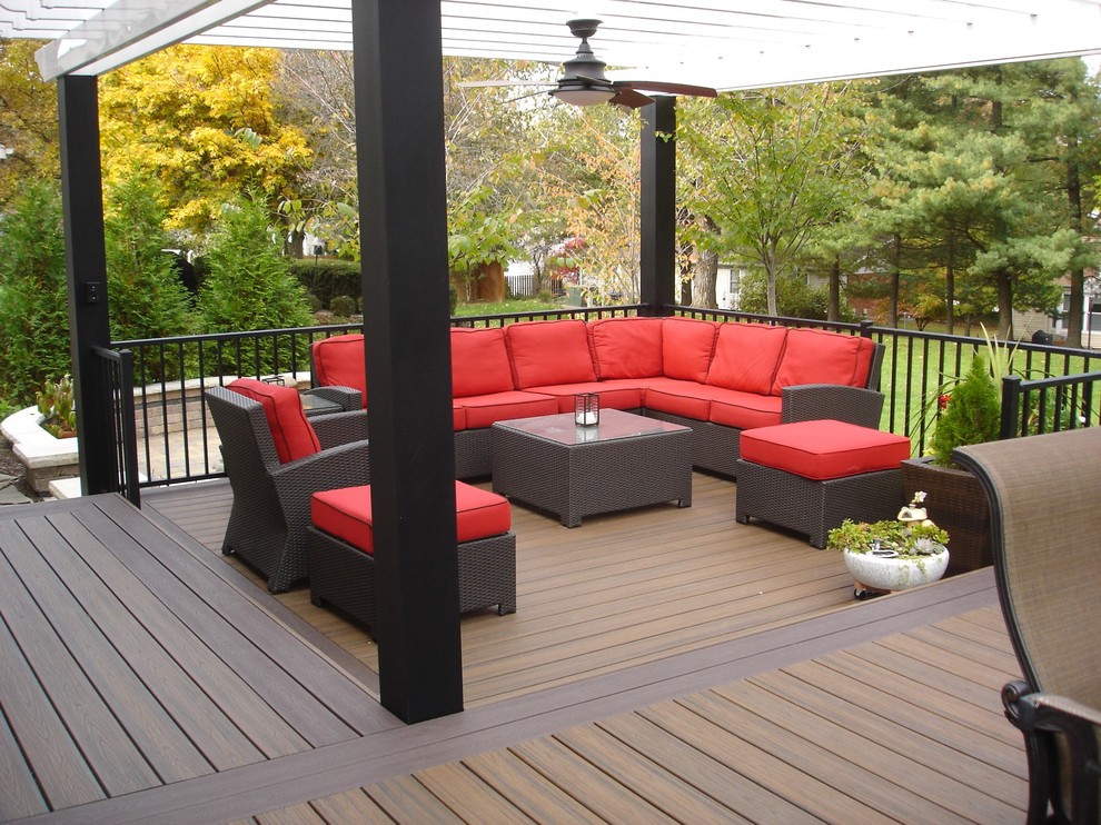 Inspiration for a large backyard deck remodel in St Louis with a pergola