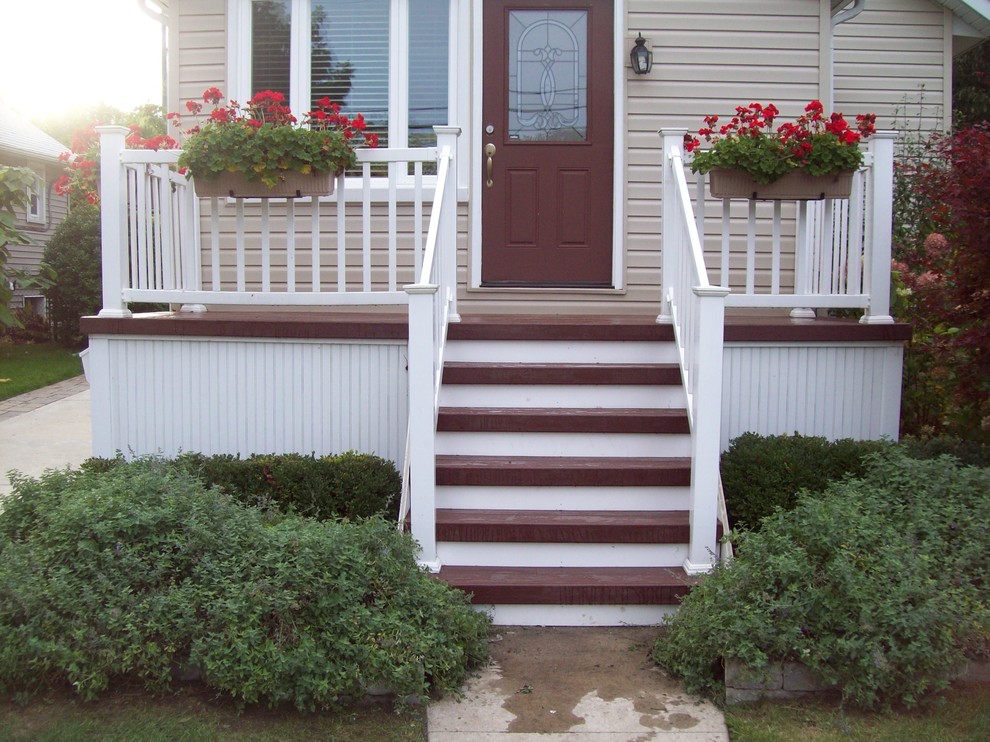 Example of a small classic deck container garden design in Detroit with no cover