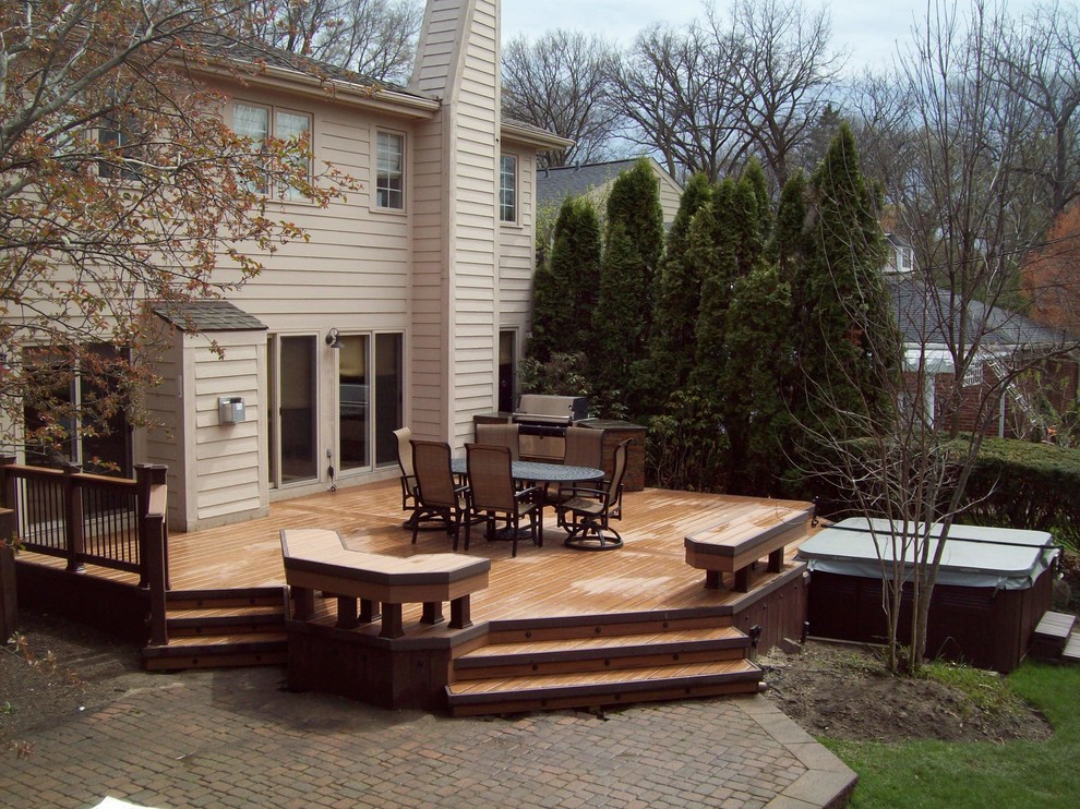 Mid-sized transitional backyard deck photo in Detroit with a fire pit and no cover