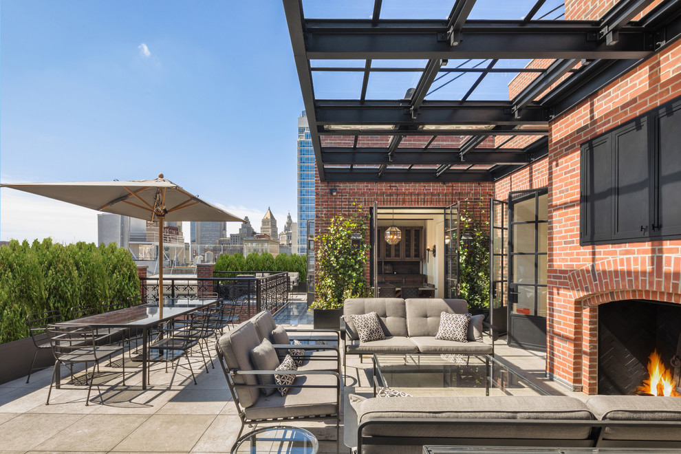 Design ideas for a classic roof rooftop terrace in New York with an awning.