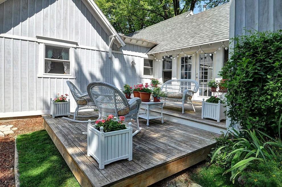 Photo of a medium sized coastal side terrace in Milwaukee with a potted garden and no cover.