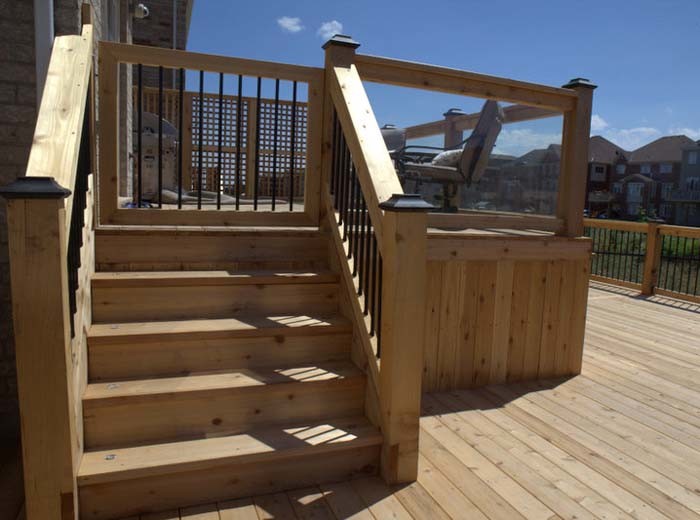Two level custom deck with glass, heavy duty lattice and metal pickets