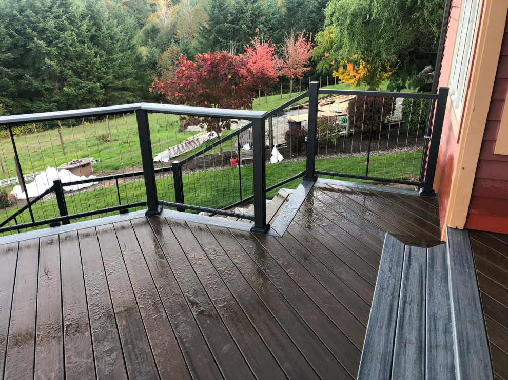 Inspiration for an expansive modern back first floor metal railing terrace in Portland with no cover.