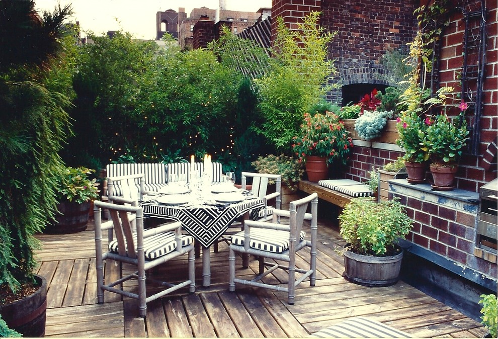 Inspiration for a mid-sized rooftop outdoor kitchen deck remodel in New York with no cover