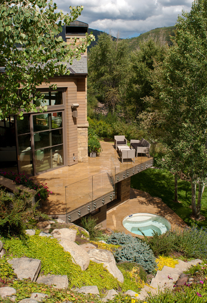 This is an example of a large contemporary side terrace in Denver with no cover.