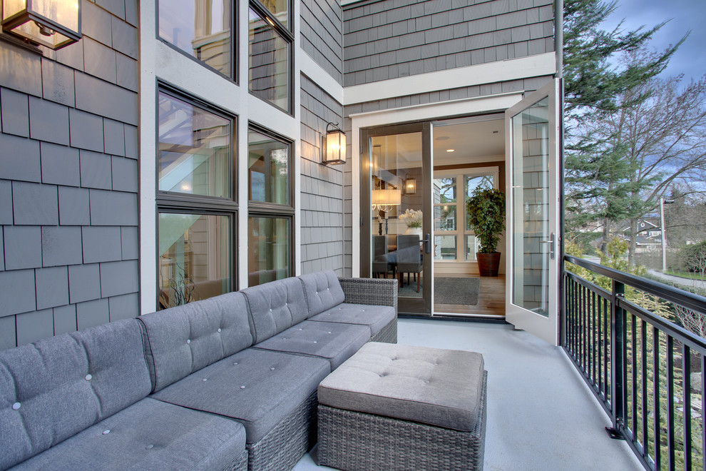 Arts and crafts side yard deck photo in Seattle with a roof extension