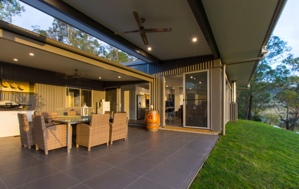 Inspiration for a medium sized rural back terrace in Brisbane with a roof extension.