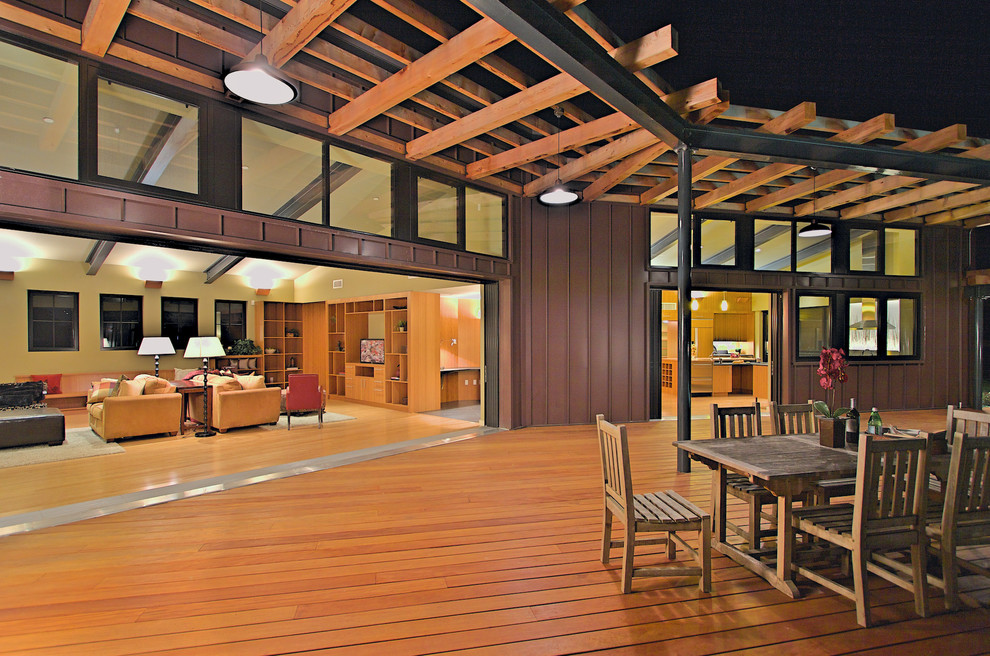 Design ideas for a large contemporary back terrace in San Francisco with a pergola and feature lighting.