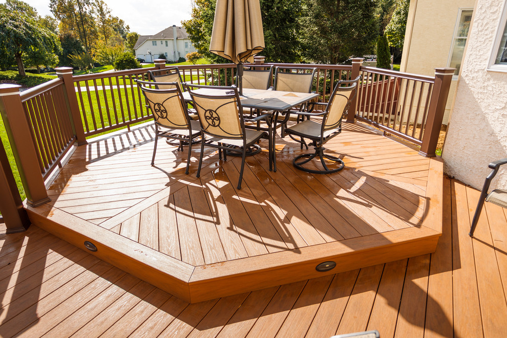 Inspiration for a mid-sized timeless backyard deck remodel in Other with no cover