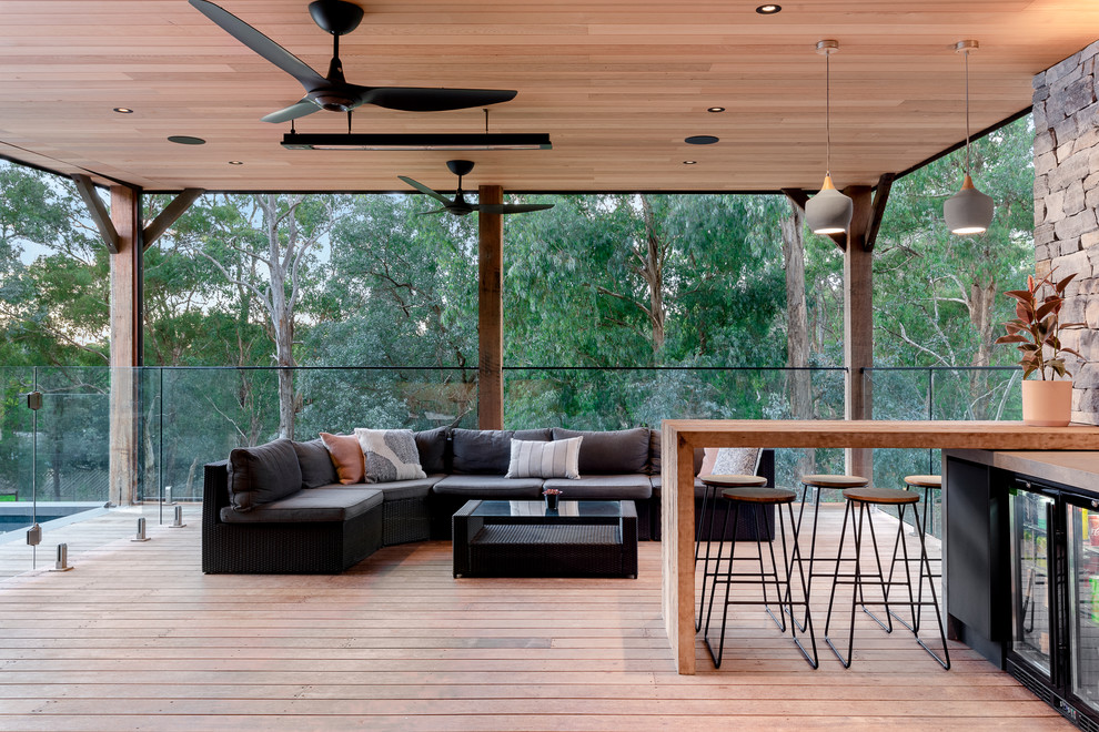 This is an example of a contemporary terrace in Melbourne with a roof extension.