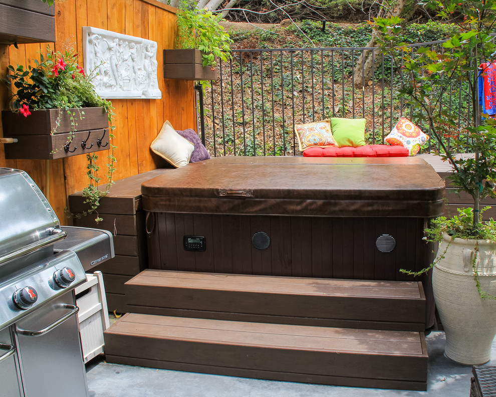 Mid-sized eclectic backyard water fountain deck photo in Orange County