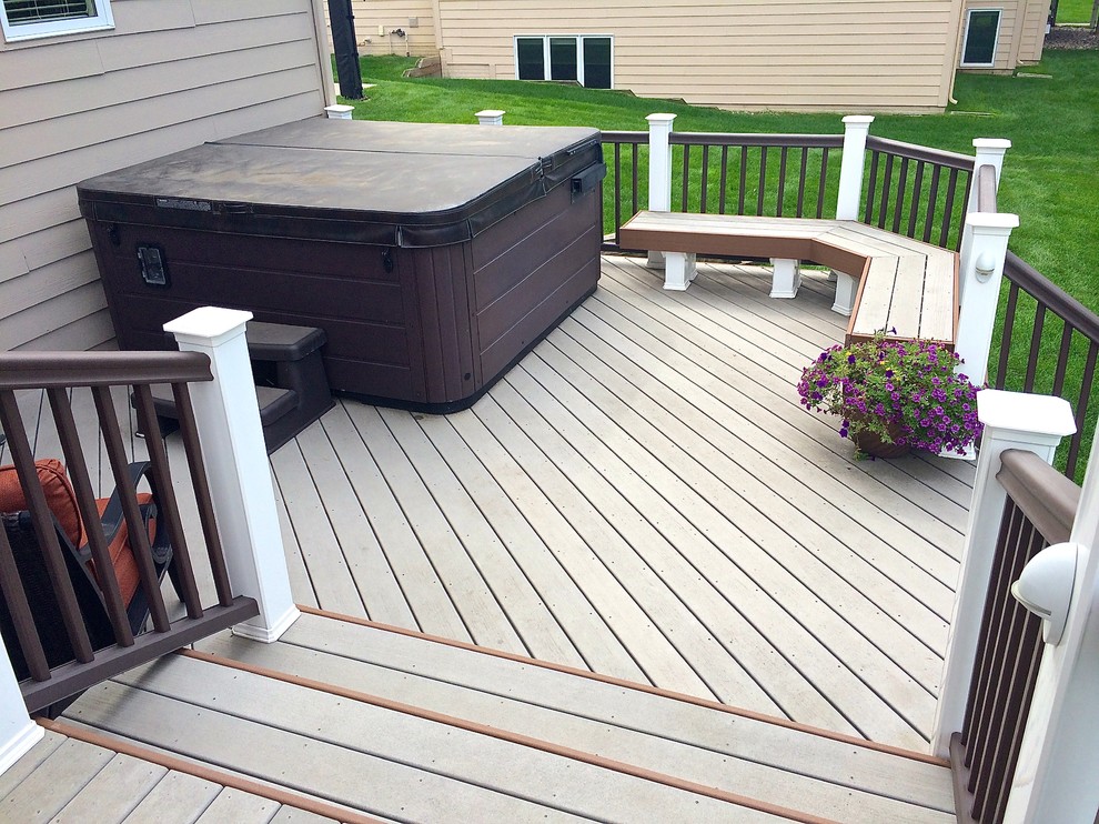 Mid-sized elegant side yard deck photo in Other with a pergola