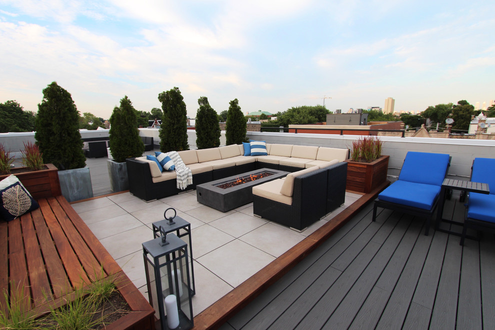 Photo of a large contemporary roof terrace in Chicago with a pergola and a fire feature.