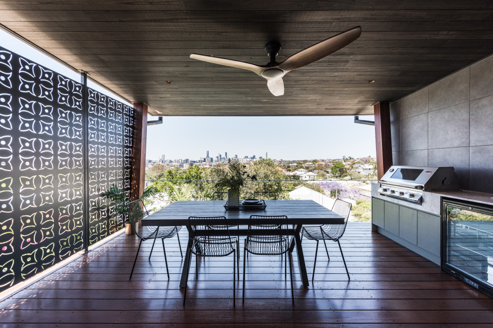 Photo of a contemporary terrace in Brisbane with an outdoor kitchen.