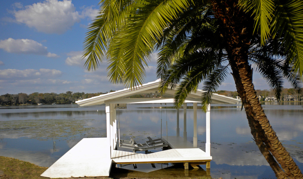Mid-sized island style backyard dock photo in Orlando