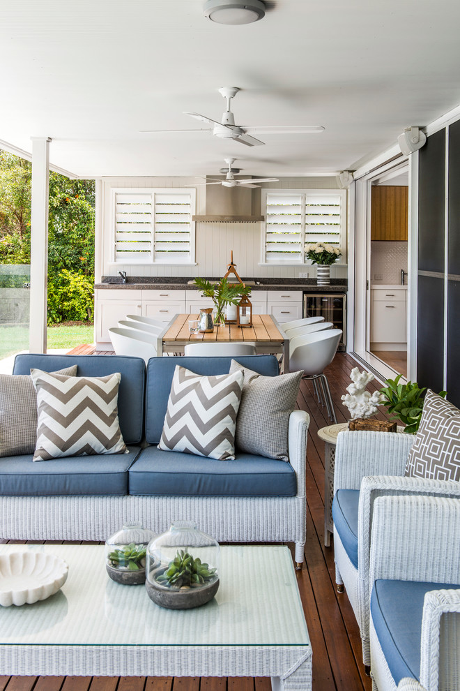Inspiration for a timeless backyard deck remodel in Brisbane with a roof extension