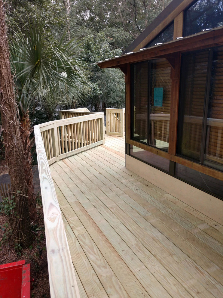 Mid-sized backyard deck photo in Charleston with no cover