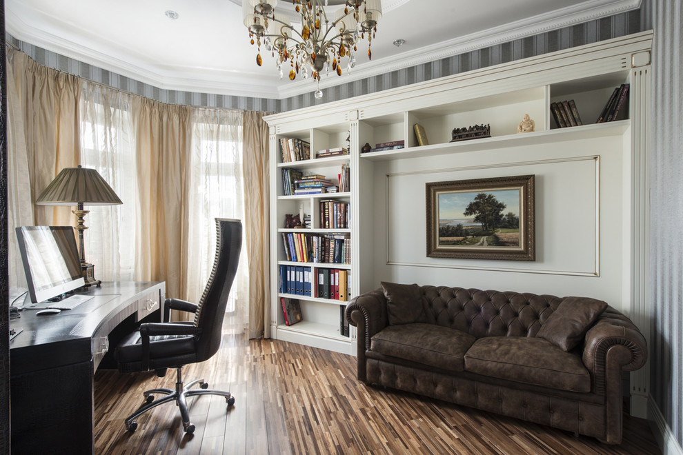 Medium sized classic study in Moscow with multi-coloured walls and a freestanding desk.