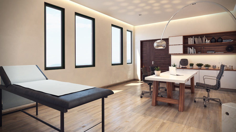 Imagen de despacho moderno pequeño con paredes blancas, suelo de baldosas de terracota, escritorio independiente y suelo beige