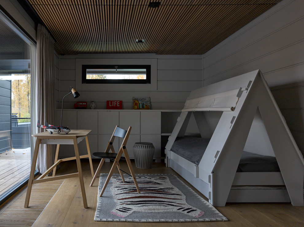 Modelo de habitación infantil unisex escandinava con paredes grises, suelo de madera clara y suelo beige